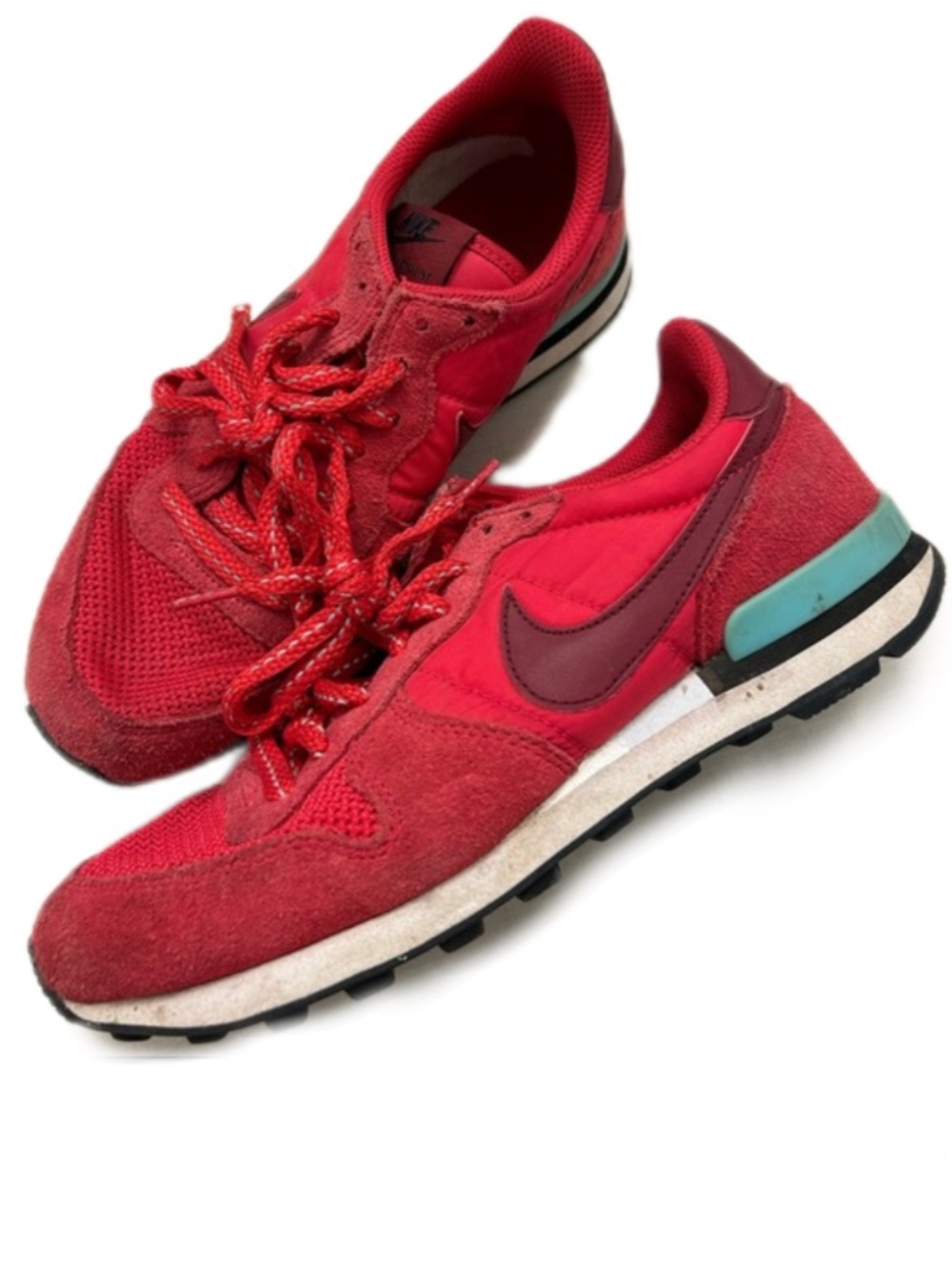 Vintage red Nike Internationalist sneakers with blue heel details